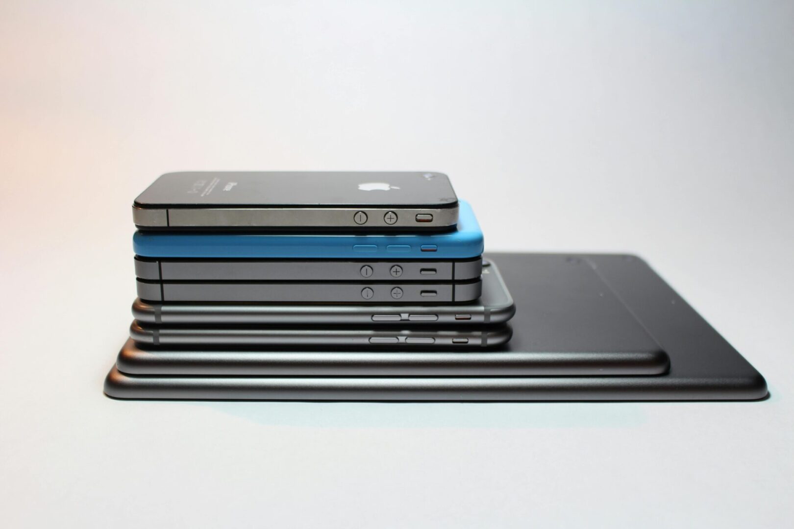 A stack of cell phones on top of each other.
